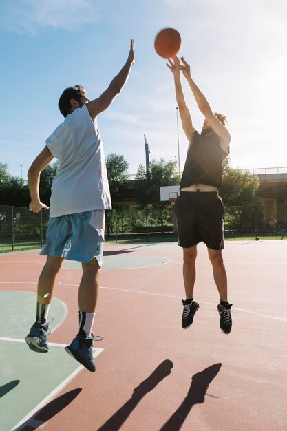 Men playing basketball