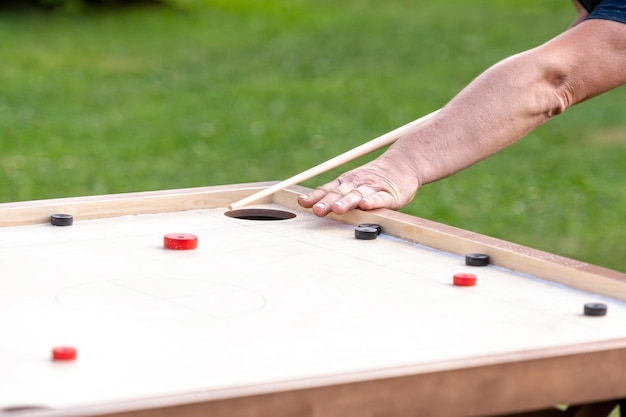 Photo men playing novuss novuss is a national sport in latvia similar to pocket billiards or pool