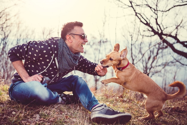 Men playing outdoors with dog