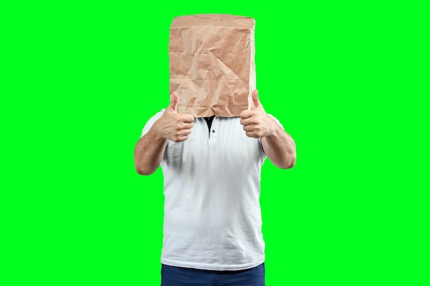 Men put a paper bag on their heads, show the class, support motivation. Isolate on green background, images are easy to crop for use anywhere, copy space.