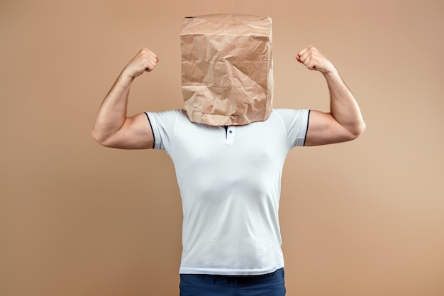 Men put a paper bag on their heads, shows strength, biceps, motivation, support, chorism.