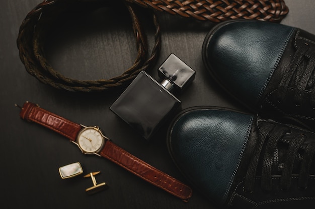 Men's accessories on the brown wooden table