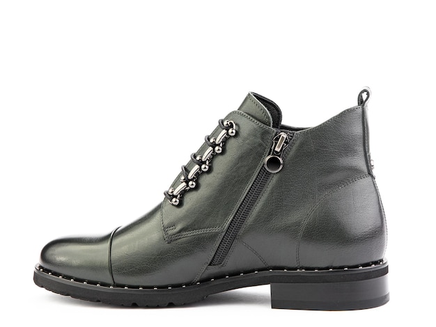 Men's autumn green leather jodhpur boots with laces and average
heels isolated white background left side view fashion shoes