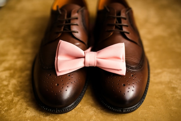 Men's black shoes and tie. Decoration of a man for a wedding.