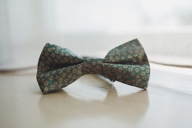 Men's bow tie on a wooden background