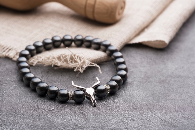 men's bracelet made of natural stones with a skull