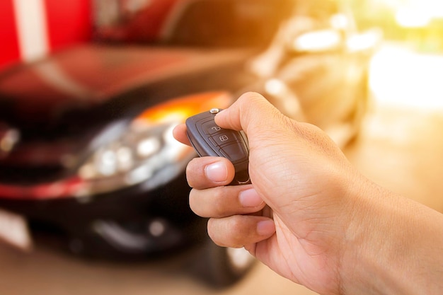 Men's hand presses on the remote control car