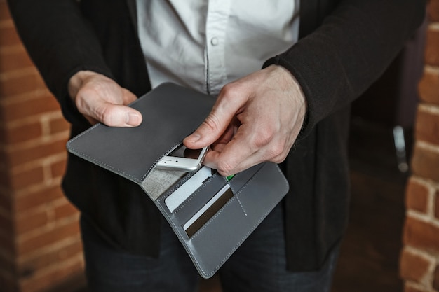 Photo men's hand wallet in the pocket