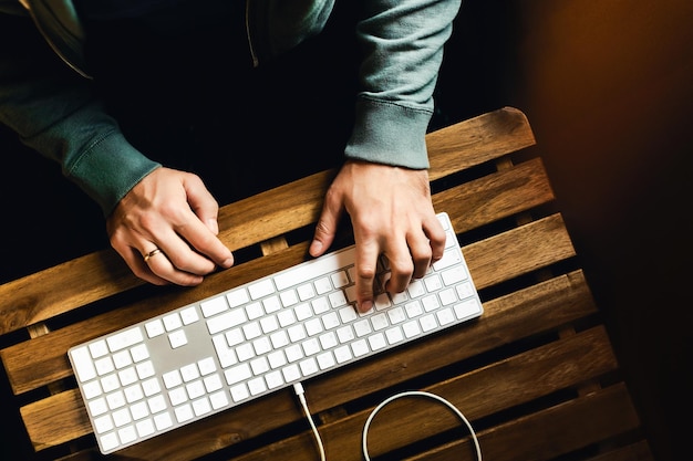 Men's hands on the keyboard