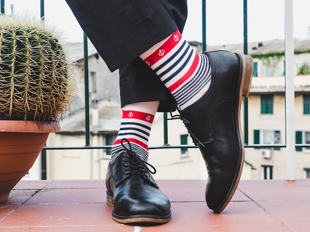 Men's legs, stylish shoes and colorful socks