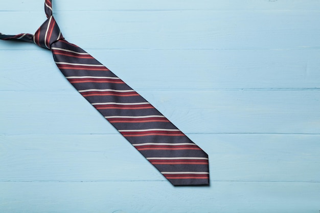 Men's neck tie on blue background