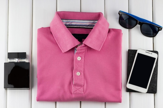 Men's set of t-shirt, sunglasses and smartphone