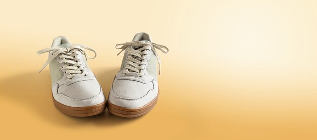 Men's sneakers isolated on orange