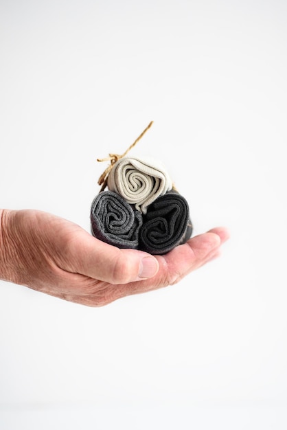 Men's socks in the palms on a white background closeup