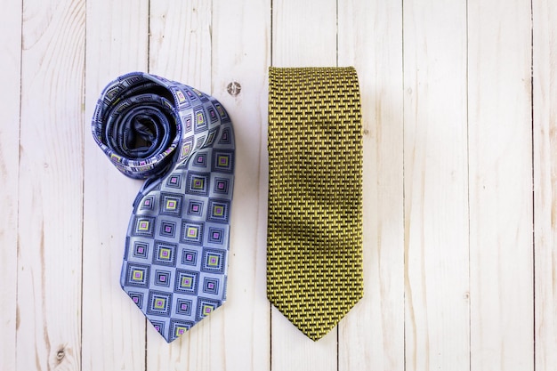 Men's ties on a wood background.