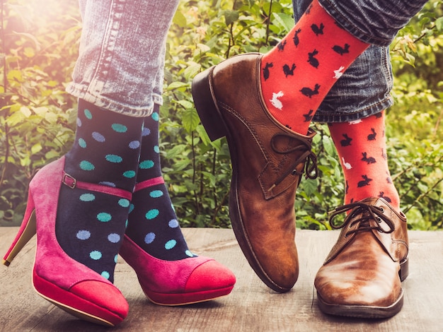 Men's and women's legs, bright socks. 