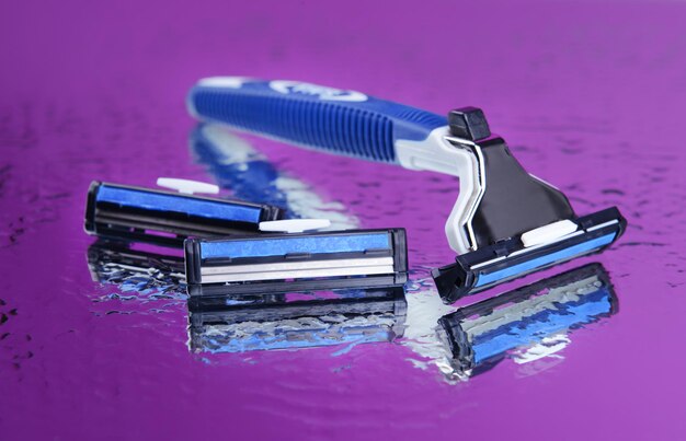 Men shaver on purple background