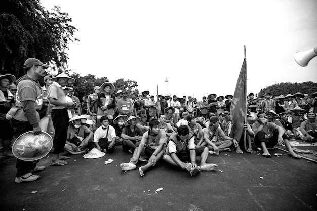 men sitting on street against clear sky