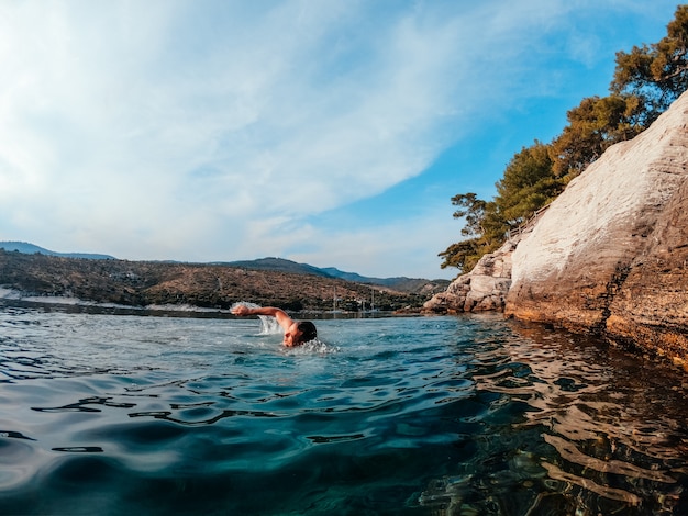 Men swimming in the sea