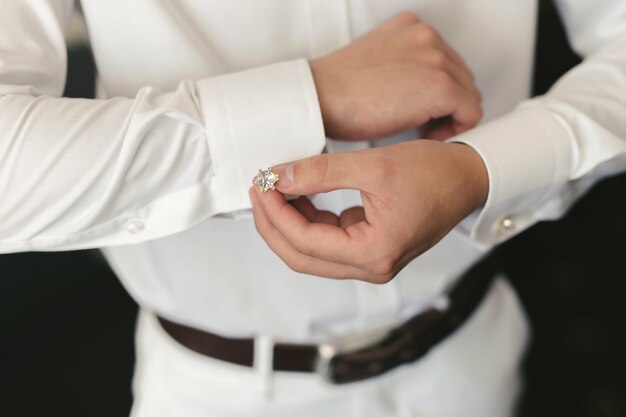 Men wear a shirt and cufflinks