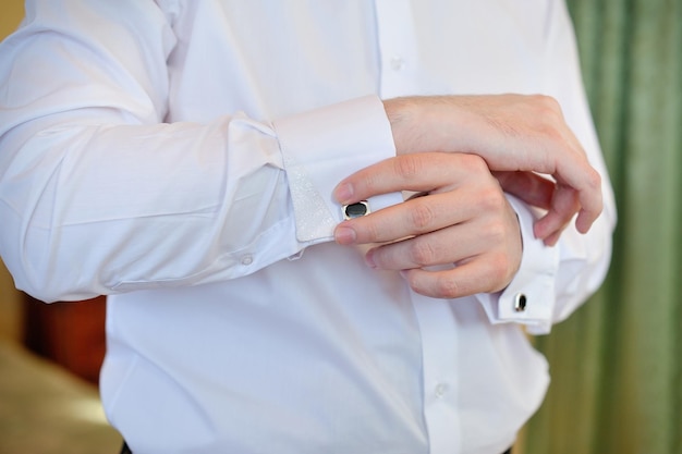 Men wear a shirt and cufflinks