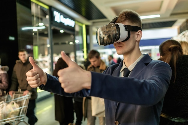 Men wearing virtual reality glasses playing the game3D gadget headset goggles technology Cardboard VR glasses