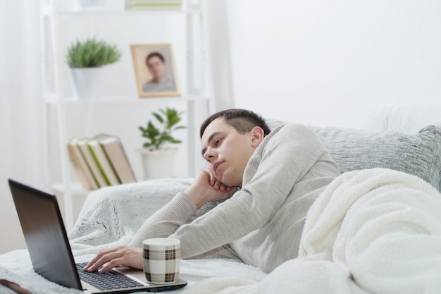 Men with laptop at home