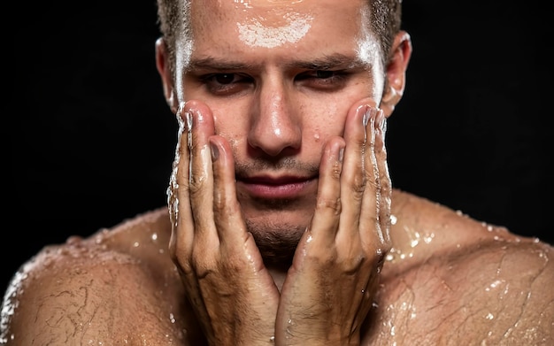 Men with oily or wet skin on black background