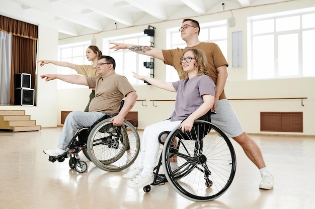 Men and women practicing wheelchair dance