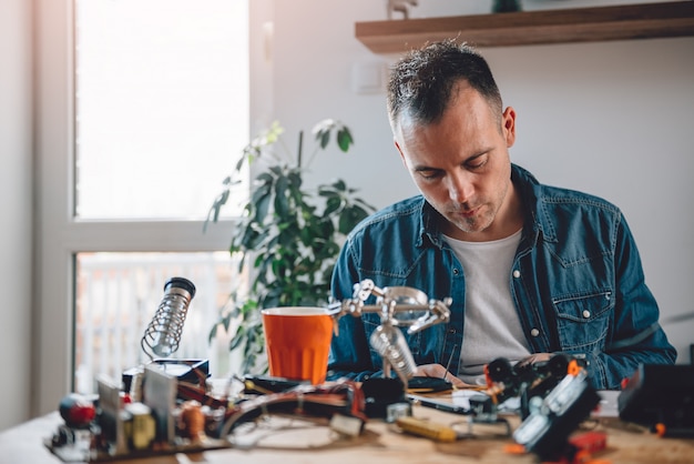 Men working with electronic components 