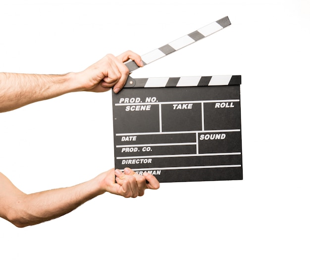 Foto mens die een clapperboard houdt