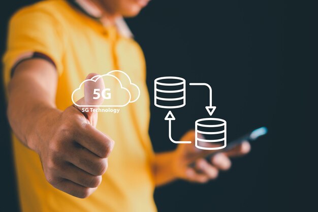 mens hands use mobile phones to connect to the internet 5g virtual internet of things is a hightech technology and all devices are connected and controlled through highspeed internet 5g