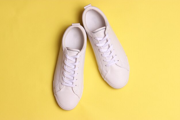 Mens sneakers on a colored background mens footwear minimalism