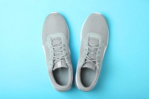 Mens sneakers on a colored background mens footwear minimalism