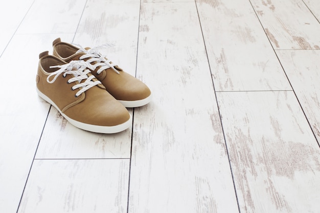 Mens summer shoes on old wooden floor