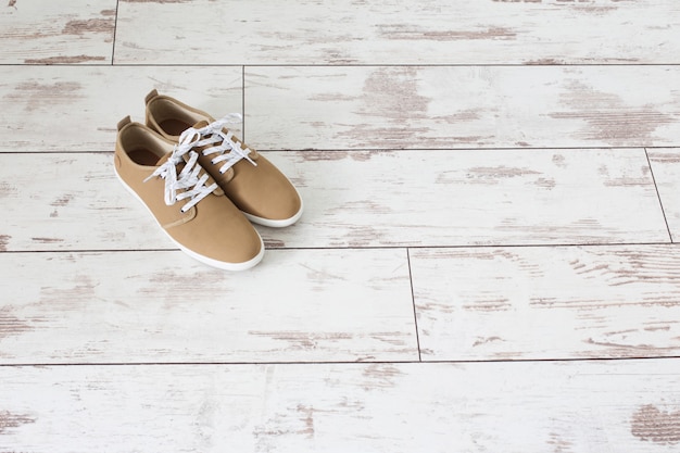 Mens summer shoes on old wooden floor