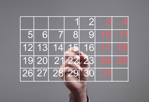 Menselijke kalender met zwarte en rode cijfers