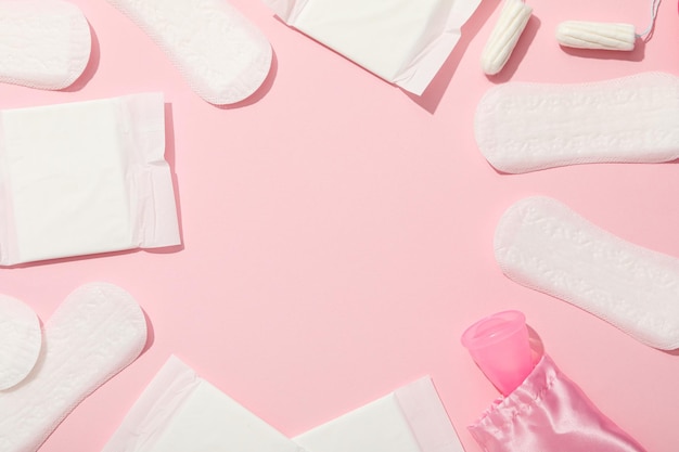 menstrual feminine hygiene products on a pink background
