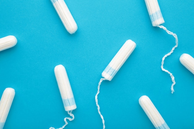 Menstrual tampons on a blue background
