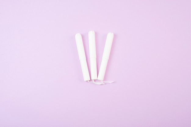 Menstrual tampons isolated on pink background. 