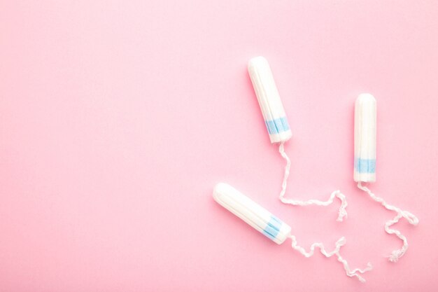 Menstrual tampons on a pink background