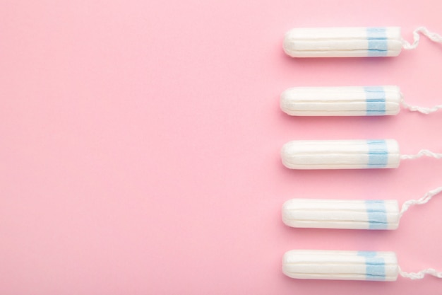 Menstrual tampons on a pink background