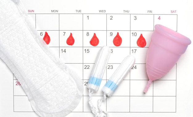 Menstruation calendar Calendar with pads and tampons menstrual cup