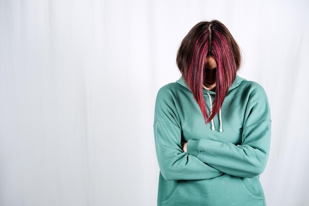 Mental health depression Anger Anxiety Bipolar disorder and panic attacks concept Studio portrait of unhappy young woman