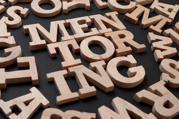 Photo mentoring text words typography written with wooden letter on black background