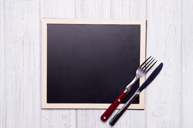 Menu blackboard with knife and fork