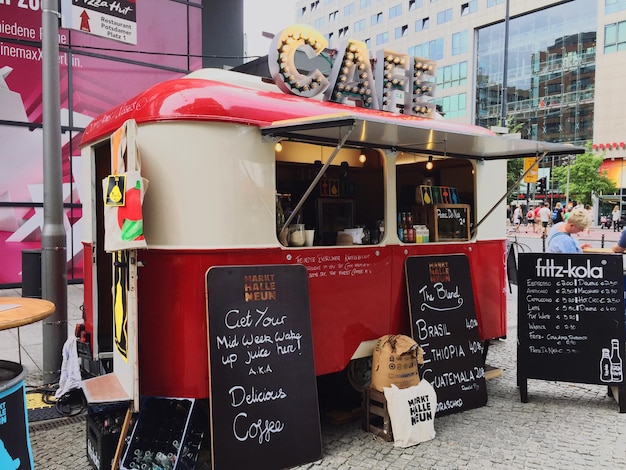 Photo menu by food truck on street in city