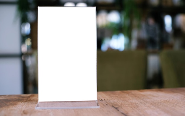 Menu frame standing on wood table in Bar restaurant cafe space for text marketing promotion