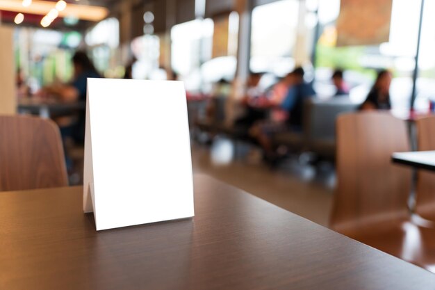 Photo menu mock up blank for text marketing promotion mock up menu frame standing on wood table in restaurant space for text