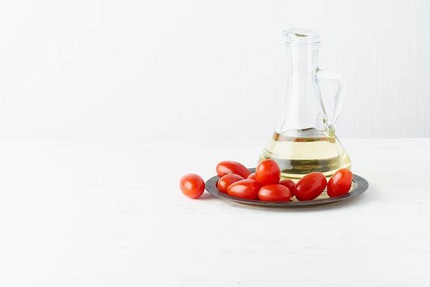 Menu, recipe, mock up, banner. Food . Glass jug for olive oil, tomatoes on plate,